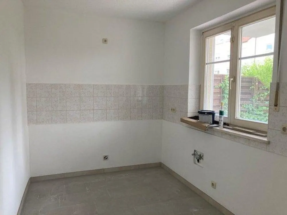 Top three-room apartment on the ground floor with terrace in Panitzsch