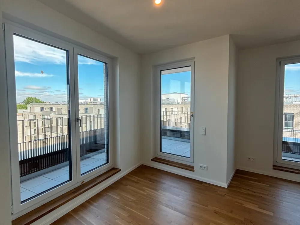 First Occupancy: Partially Furnished Penthouse Above the Roofs of Hamburg