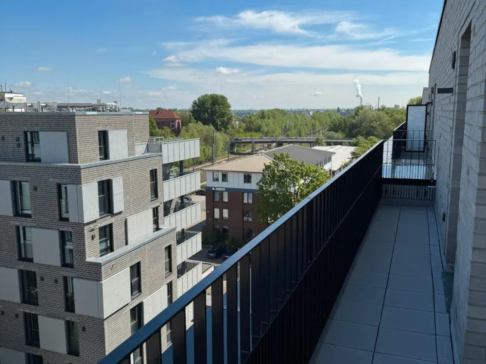 First Occupancy: Partially Furnished Penthouse Above the Roofs of Hamburg