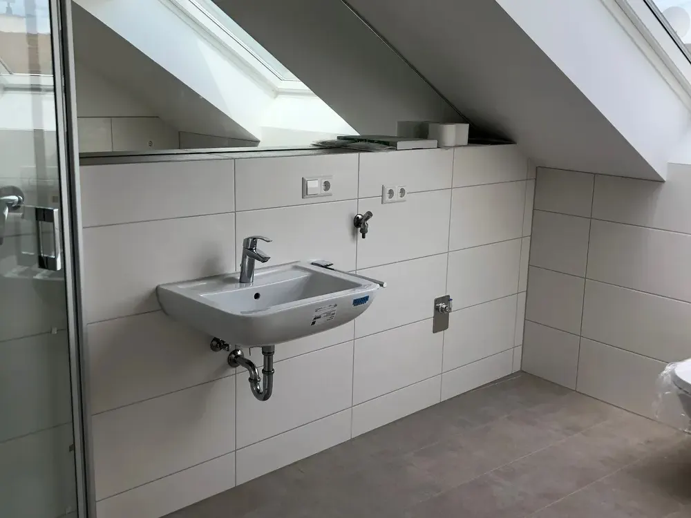 Cozy Top-Floor Apartment in Central Location of Bruchsal Including Fitted Kitchen and Parking Space