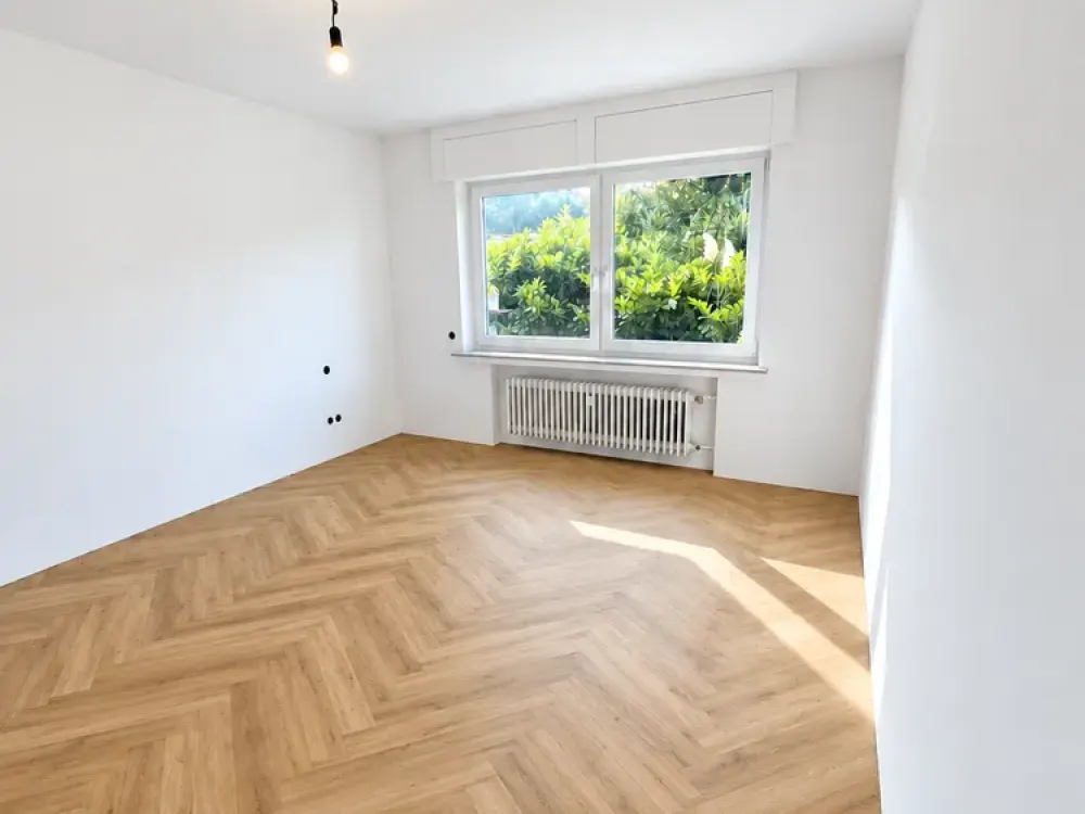 Spacious 2-Room Ground Floor Apartment with Balcony, Direct Garden Access and Garage