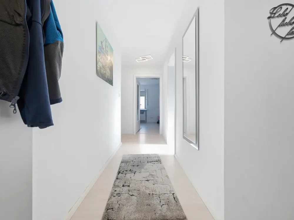 Renovated Top-Floor Apartment with Balcony, Parking Space & Large Cellar in Modernized 3-Family House