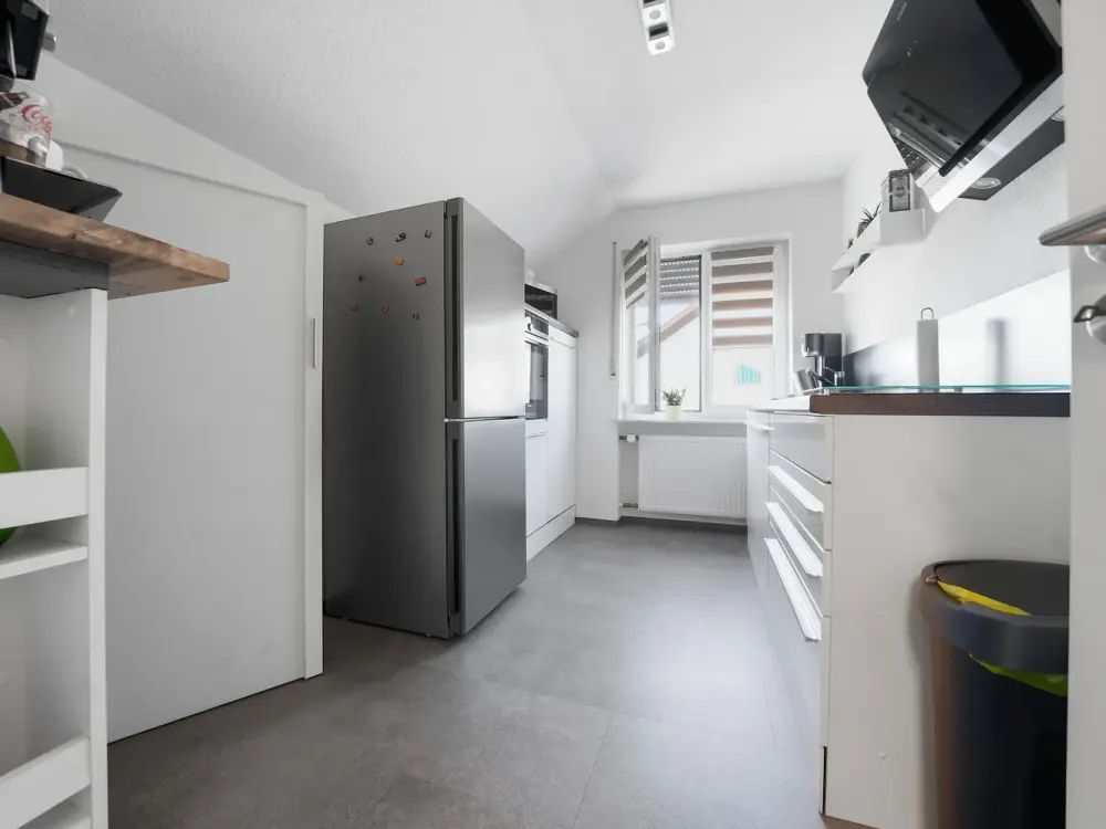 Renovated Top-Floor Apartment with Balcony, Parking Space & Large Cellar in Modernized 3-Family House