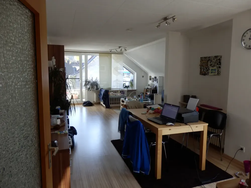 Modernized Top-Floor Apartment with Three and a Half Rooms, Balcony, and Fitted Kitchen in St. Ingbert