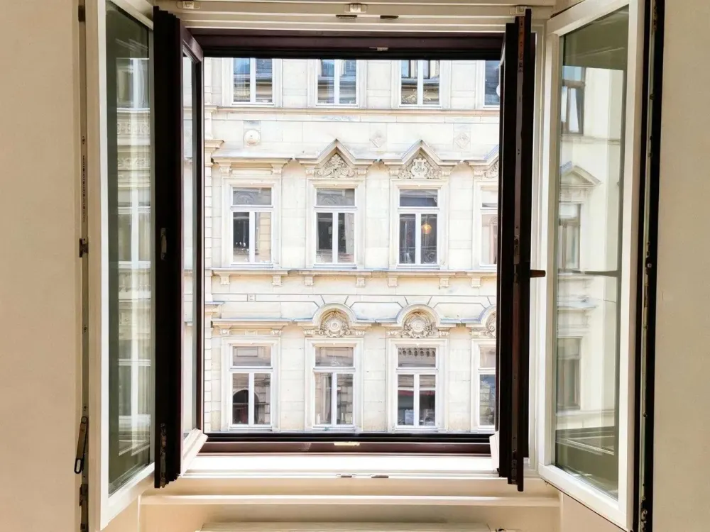 Renovated Old Building Charm with Elegant Balcony Access