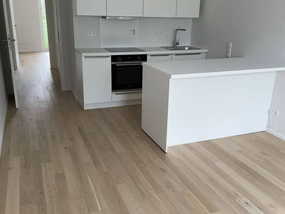 New Build: Exclusive Top-Layout 2-Room Terrace Apartment with Green View & Fitted Kitchen in Prime Location